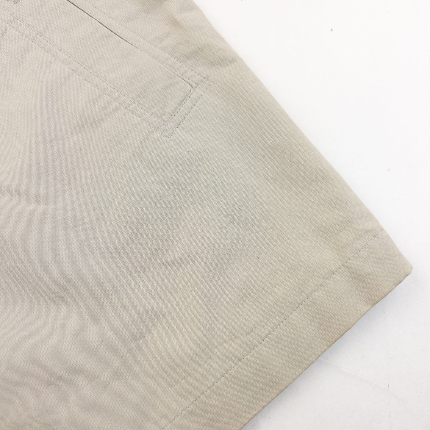 YVES SAINT LAURENT beige Harrington jacket with YSL embroidery on pocket and checkered lining.