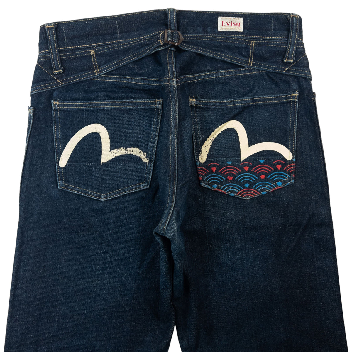 Vintage Evisu jeans with large painted artwork extending across the rear of the denim