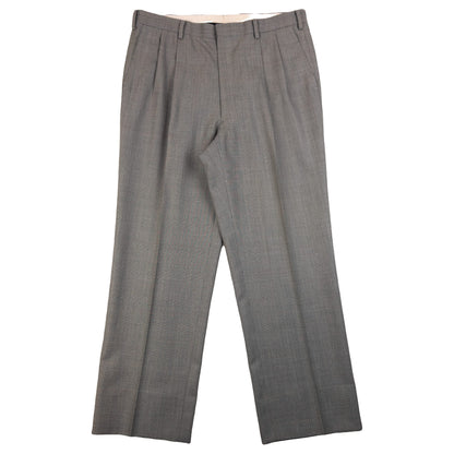 BALENCIAGA grey checkered suit set featuring a two-button jacket with flap pockets and pleated trousers