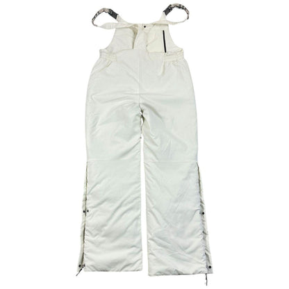 Burberry white ski overalls with logo detail on chest and adjustable straps.