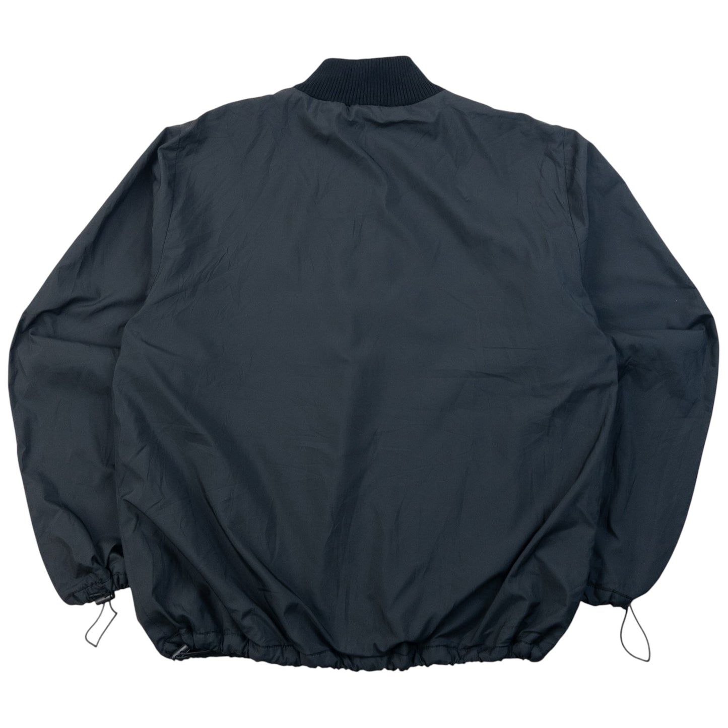 Burberry beige and black reversible jacket featuring classic Nova Check pattern and branded zipper pull.