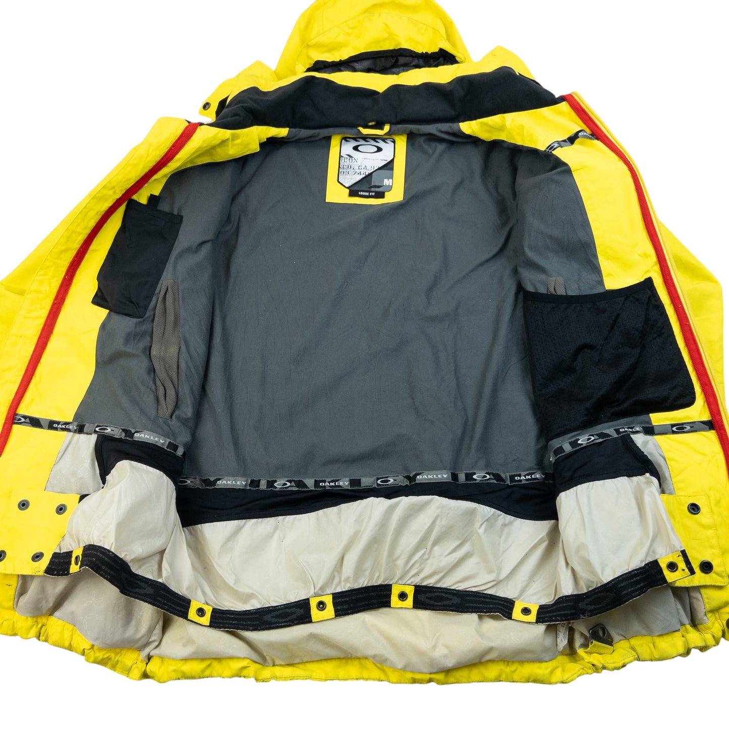 OAKLEY black and yellow zip-up snowboarding jacket bold patterned design on chest and sleeves