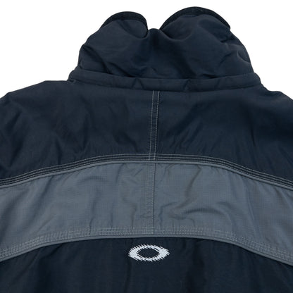 OAKLEY black and grey zip-up snowboarding jacket with embroidered logo and adjustable cuffs.