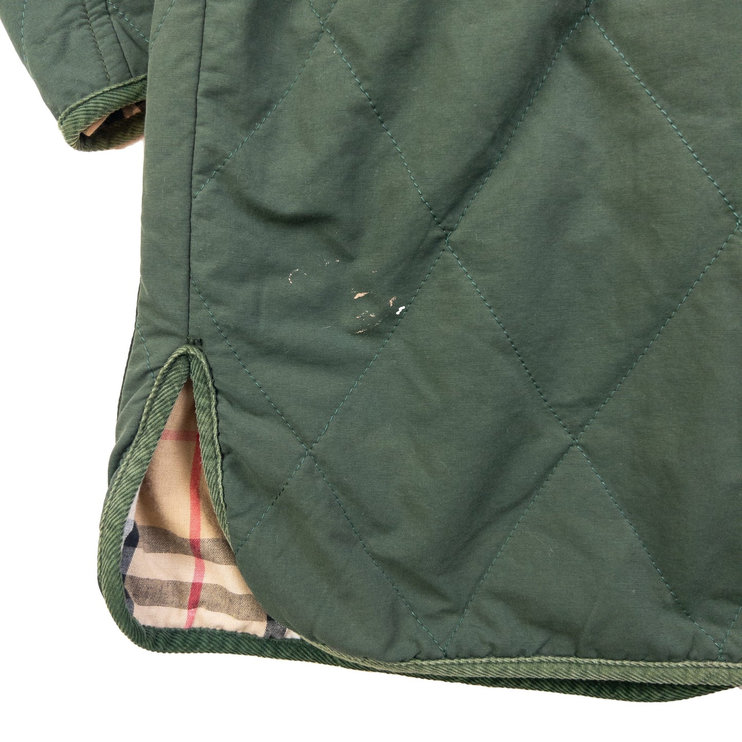 Burberry green quilted jacket with Nova Check lining, snap button closure, and corduroy collar.