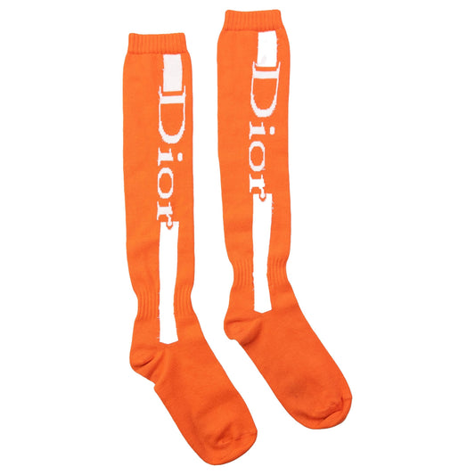 DIOR orange socks featuring white logo on front vertical panel and ribbed cuffs.