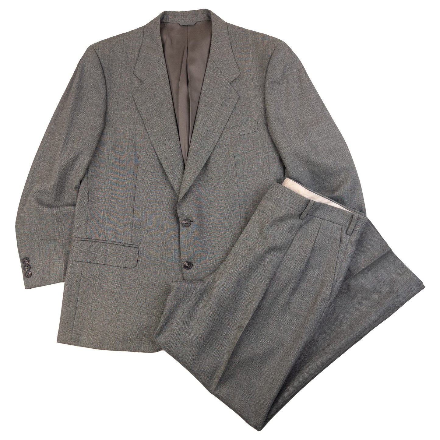 BALENCIAGA grey checkered suit set featuring a two-button jacket with flap pockets and pleated trousers