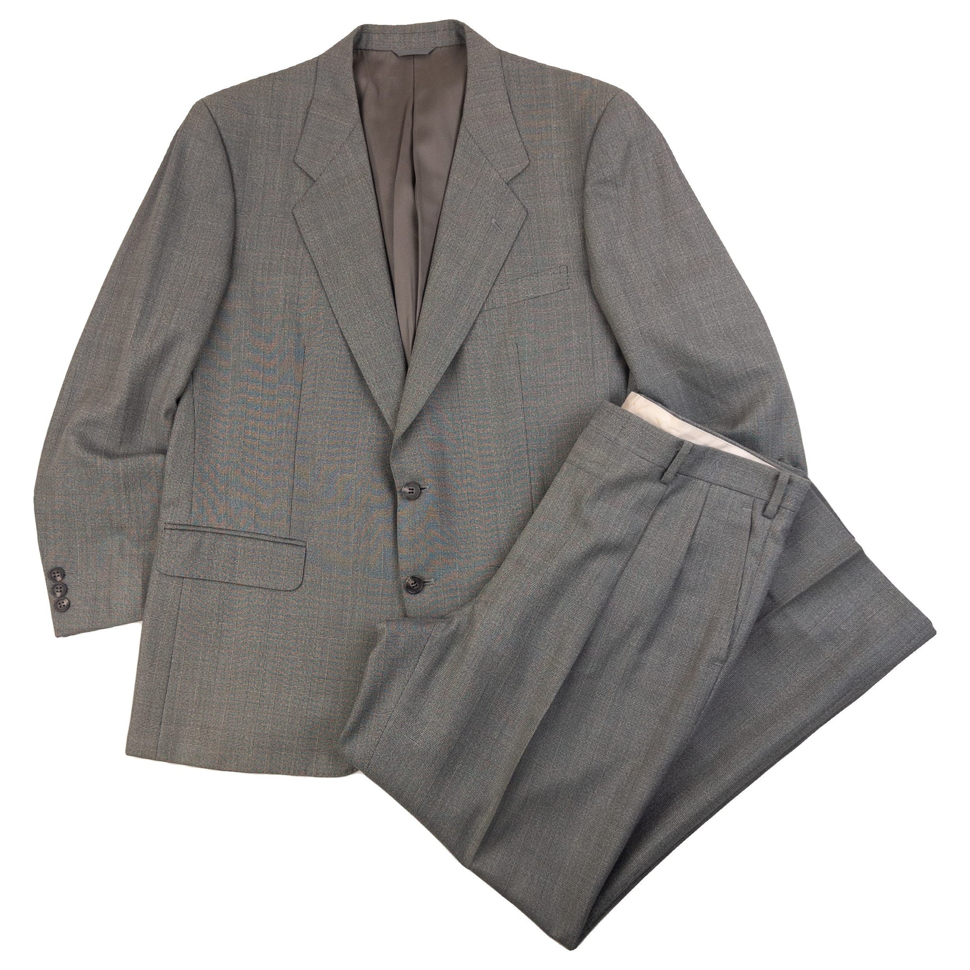 BALENCIAGA grey checkered suit set featuring a two-button jacket with flap pockets and pleated trousers