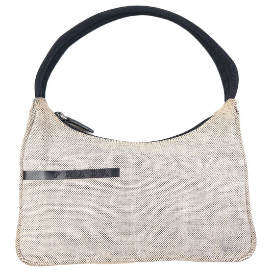 Prada beige and black shoulder bag zip top closure and logo plaque detail inside.