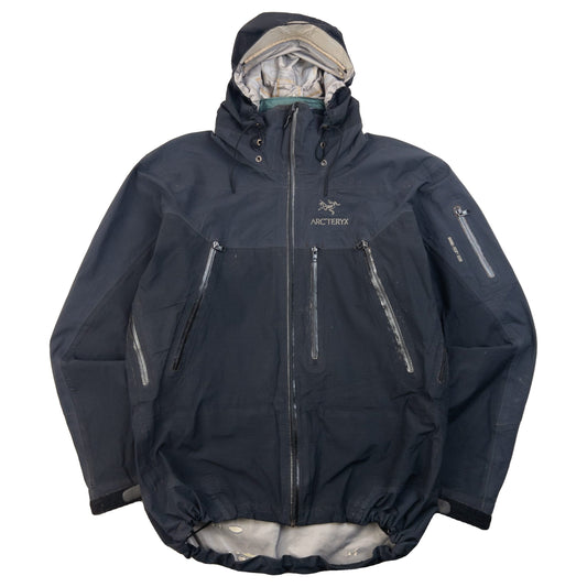 ARCTERYX black jacket featuring adjustable hood, multiple zip pockets, and hook and loop cuffs.