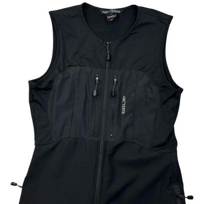 ARCTERYX black lightweight zip-up jumpsuit with distinctive logo on chest and zippered pockets.