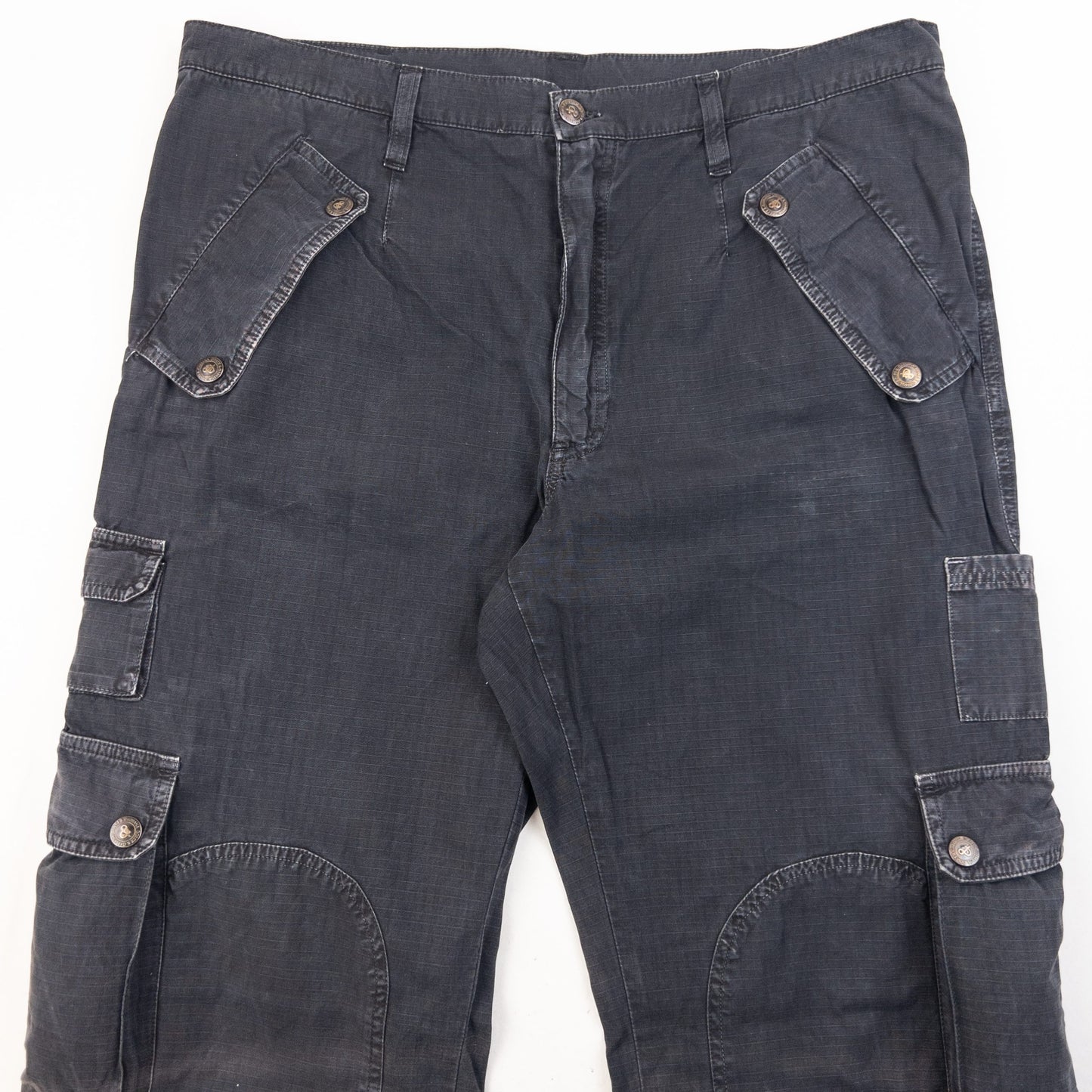 DOLCE & GABBANA black cargo trousers with multiple flap pockets and reinforced knee patches.
