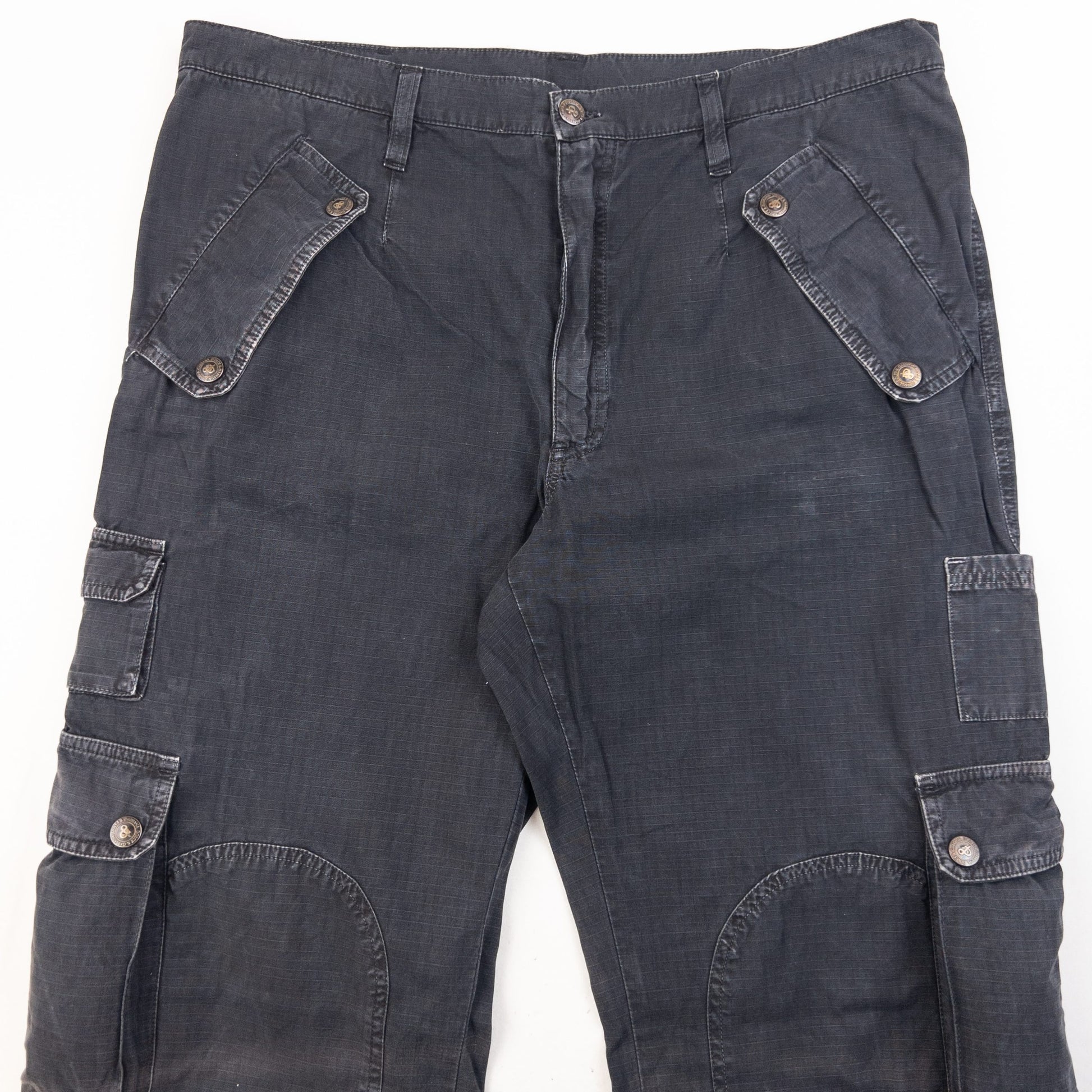 DOLCE & GABBANA black cargo trousers with multiple flap pockets and reinforced knee patches.