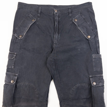 DOLCE & GABBANA black cargo trousers with multiple flap pockets and reinforced knee patches.