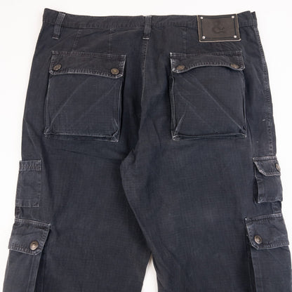 DOLCE & GABBANA black cargo trousers with multiple flap pockets and reinforced knee patches.
