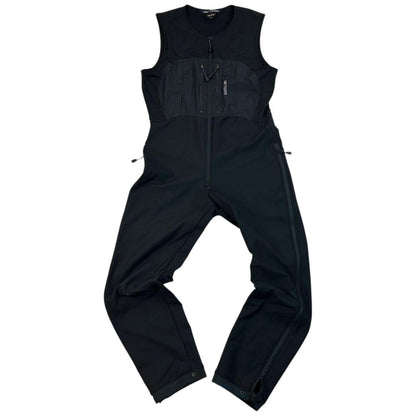 ARCTERYX black lightweight zip-up jumpsuit with distinctive logo on chest and zippered pockets.
