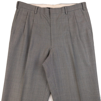 BALENCIAGA grey checkered suit set featuring a two-button jacket with flap pockets and pleated trousers