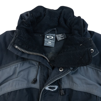 OAKLEY black and grey zip-up snowboarding jacket with embroidered logo and adjustable cuffs.