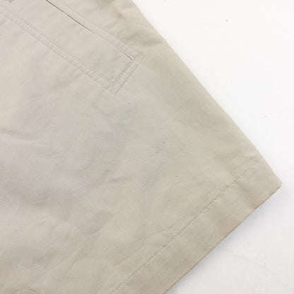 YVES SAINT LAURENT beige Harrington jacket with YSL embroidery on pocket and checkered lining.