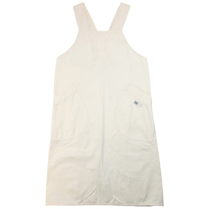 ISSEY MIYAKE beige apron with crossed back straps and stamped logo pocket detail