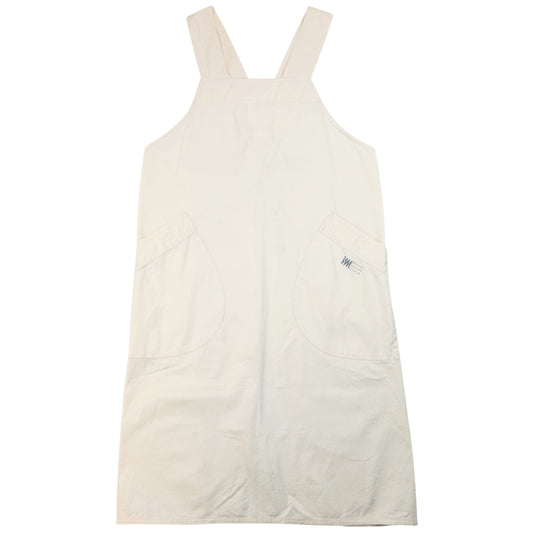 ISSEY MIYAKE beige apron with crossed back straps and stamped logo pocket detail
