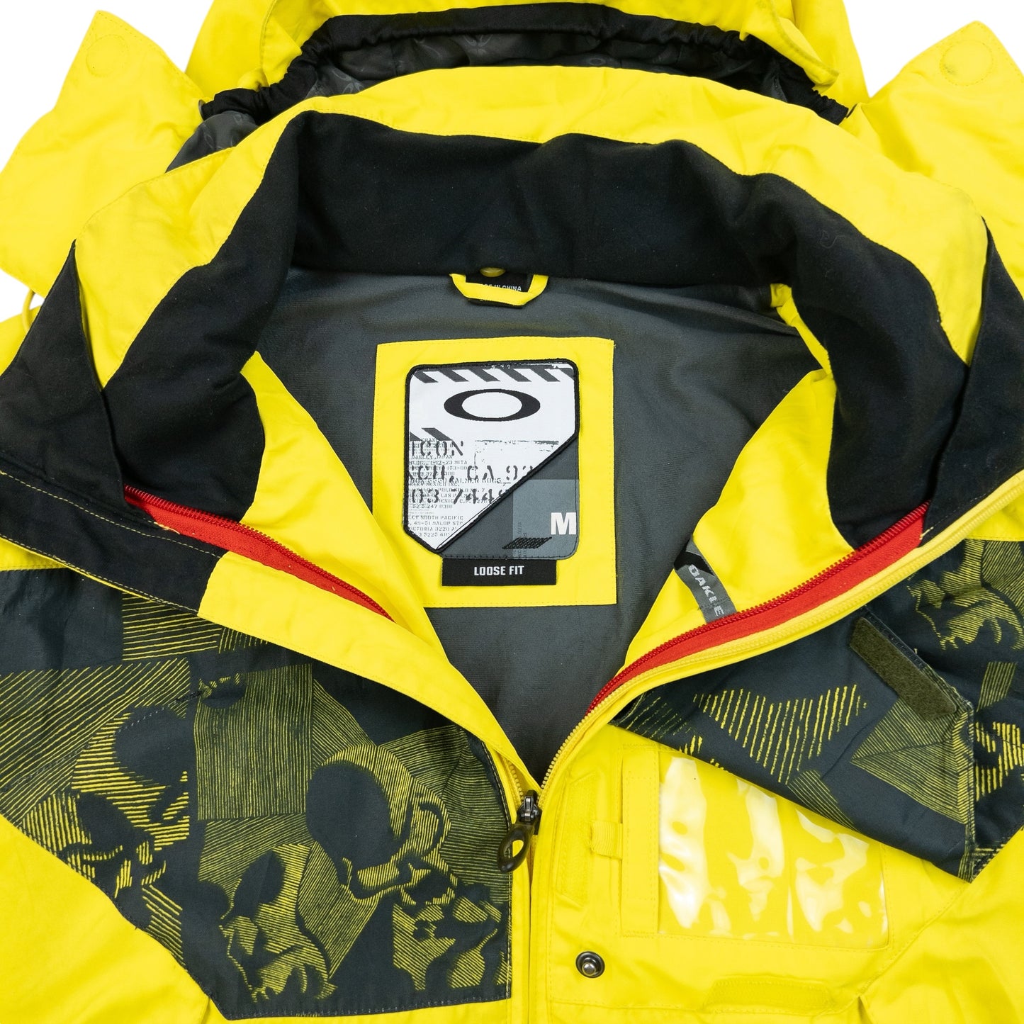 OAKLEY black and yellow zip-up snowboarding jacket bold patterned design on chest and sleeves