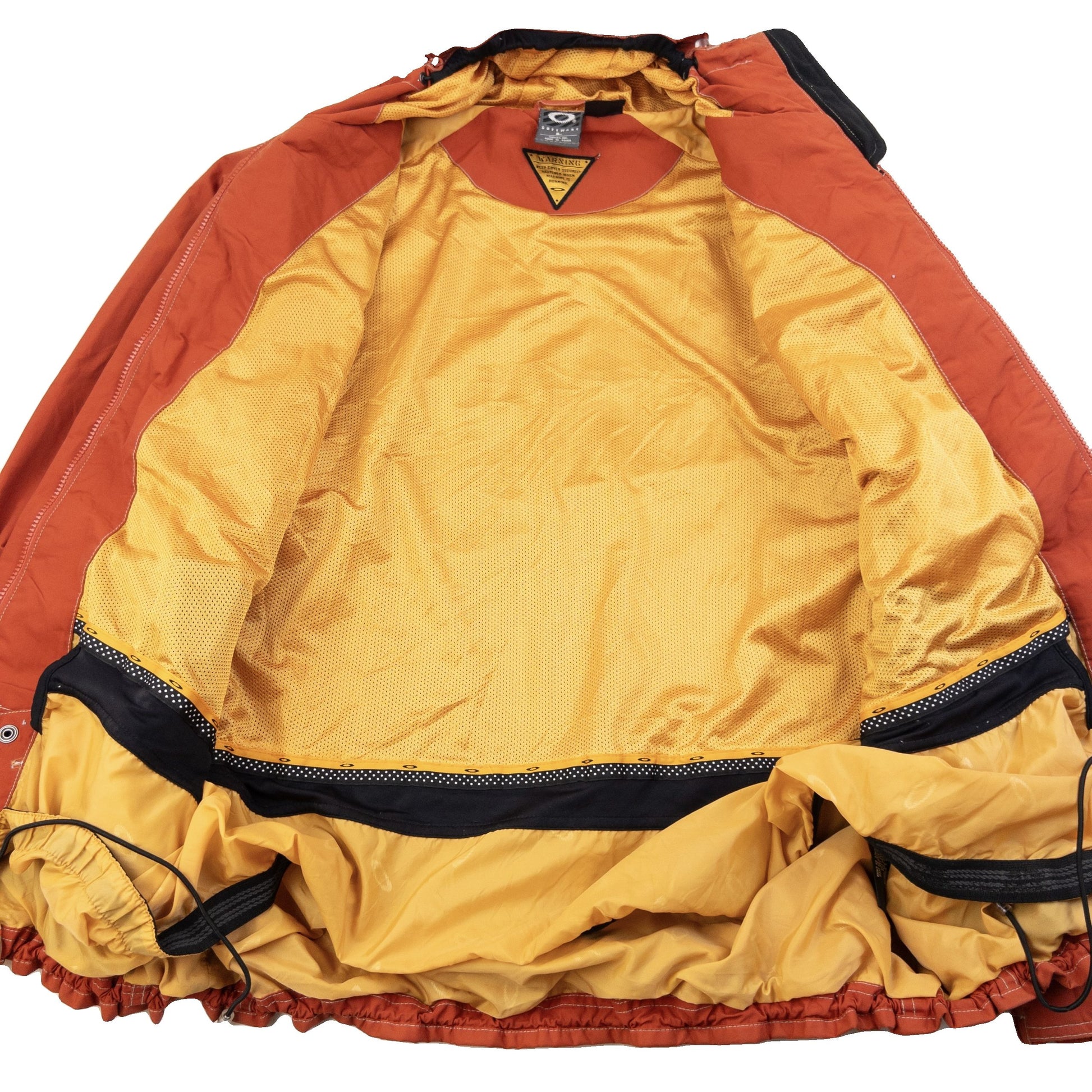 OAKLEY orange zip-up snowboarding jacket with reflective strip detail on chest and hood.