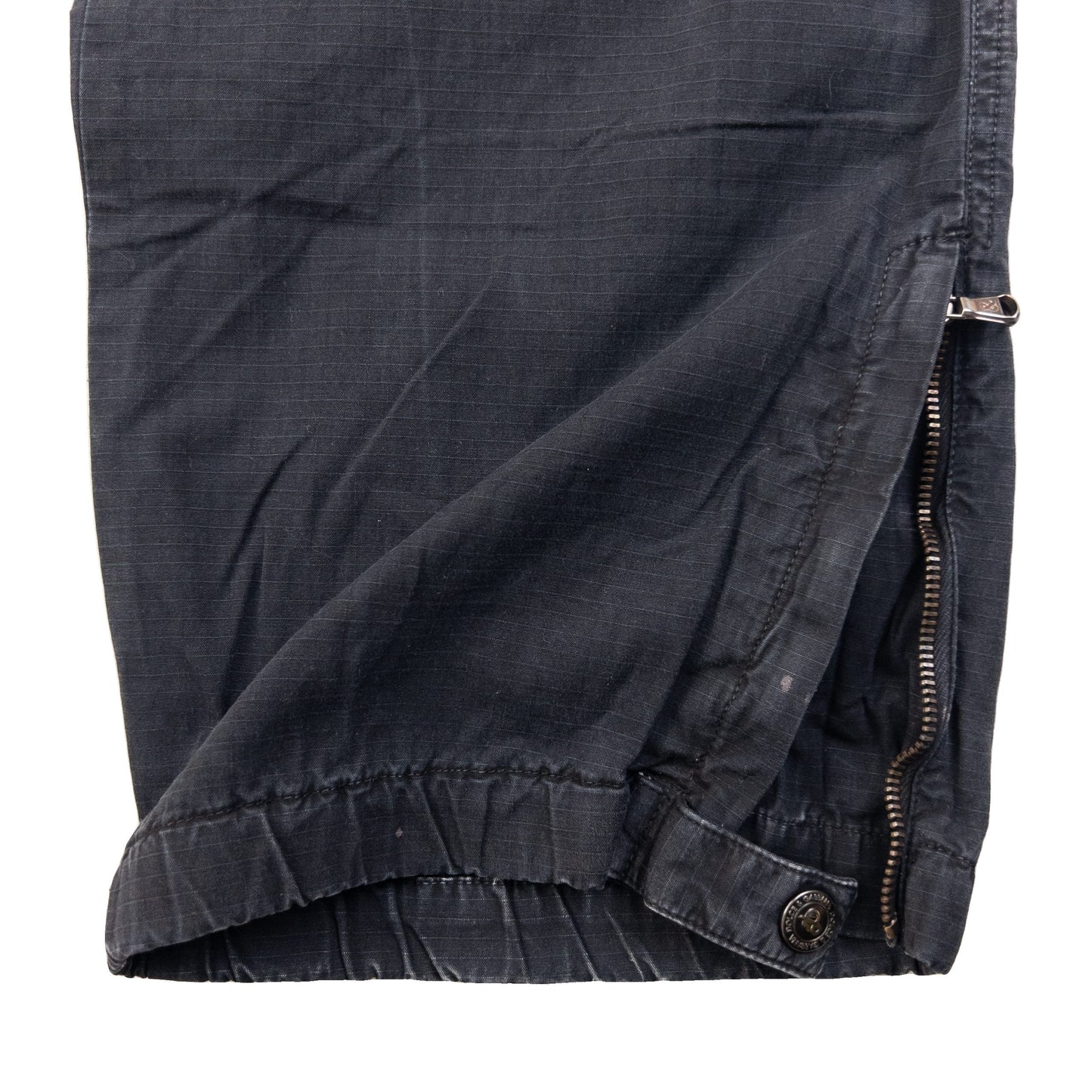 DOLCE & GABBANA black cargo trousers with multiple flap pockets and reinforced knee patches.