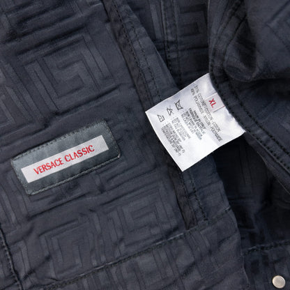 Versace Classic black button-up jacket embossed geometric pattern and branded metal buttons.
